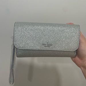 Brand new Kate Spade purse/crossbody. Sparkly silver